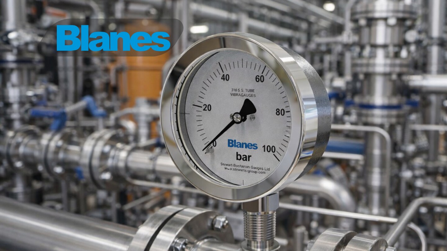 How-to-Choose-correct-Pressure-Gauges Technician selecting an industrial pressure gauge on a process pipeline in a manufacturing plant.